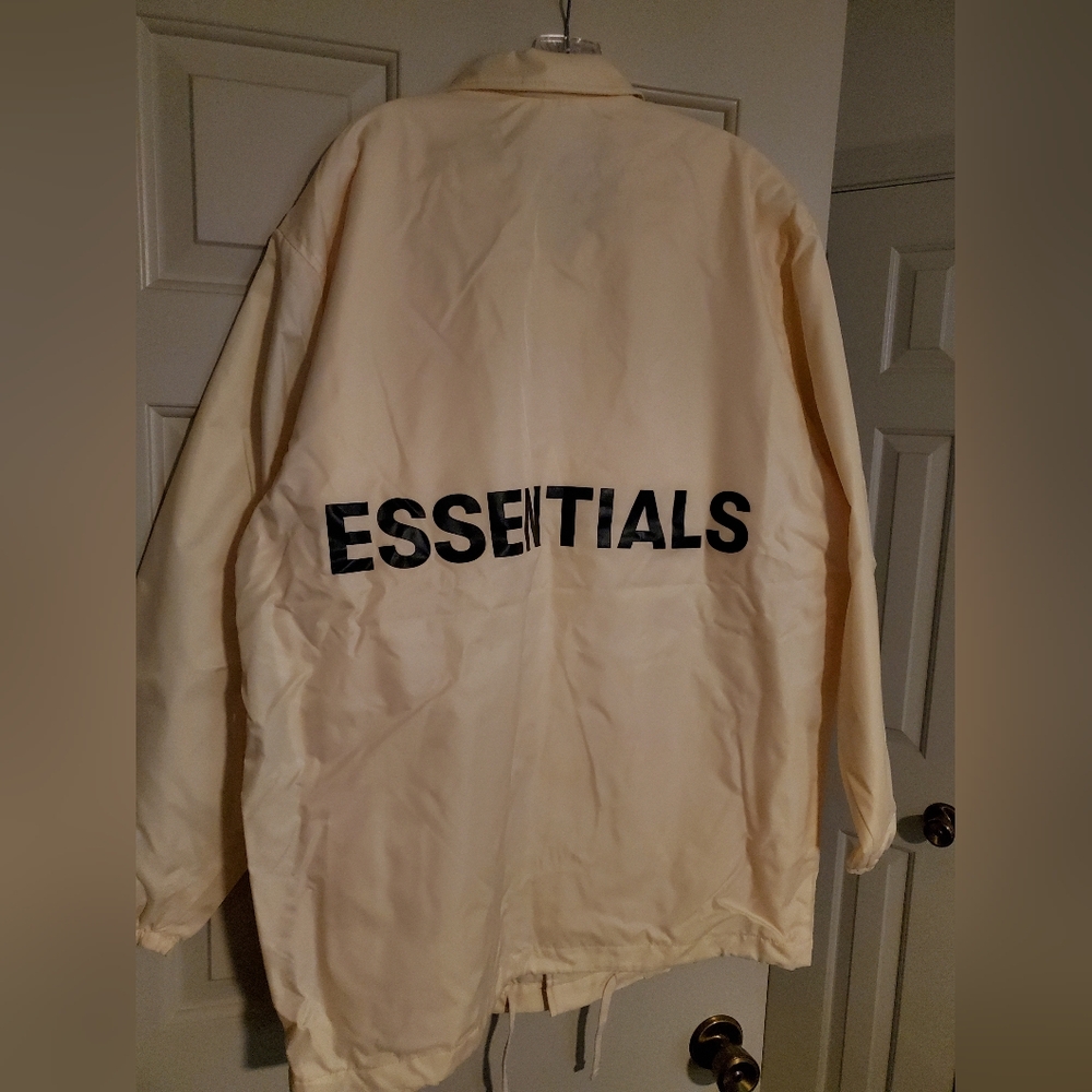FOG Essentials Graphic Coach Jacket. Color Cream. Size Large.